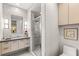 Stylish bathroom featuring a glass shower enclosure, modern vanity and accent lighting at 358 Solitude Peak Ln, Henderson, NV 89012