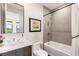 Contemporary bathroom featuring a shower-tub combo and updated fixtures at 358 Solitude Peak Ln, Henderson, NV 89012