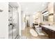 Beautiful bathroom featuring a glass enclosed shower, a soaking tub, and dual sink vanities at 358 Solitude Peak Ln, Henderson, NV 89012