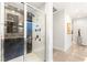 Modern bathroom featuring a glass-enclosed shower with multiple shower heads at 358 Solitude Peak Ln, Henderson, NV 89012
