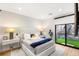 Cozy bedroom featuring a comfortable bed and access to an outdoor area at 358 Solitude Peak Ln, Henderson, NV 89012
