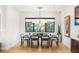 Modern dining room featuring designer lighting and scenic window views at 358 Solitude Peak Ln, Henderson, NV 89012