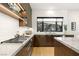 Modern kitchen featuring a gas range, stainless steel appliances, and a sleek countertop at 358 Solitude Peak Ln, Henderson, NV 89012