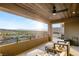 Spacious covered patio with comfortable seating and stunning city views at 358 Solitude Peak Ln, Henderson, NV 89012