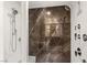 Elegant shower featuring marble-look walls, multiple shower heads and hand sprayer at 358 Solitude Peak Ln, Henderson, NV 89012