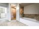 Well-appointed bathroom features a walk-in shower, soaking tub, and tiled accents at 360 E Desert Inn Rd # 807, Las Vegas, NV 89109