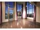 Spacious living room with hardwood floors, large windows, and balcony access with city views at 360 E Desert Inn Rd # 807, Las Vegas, NV 89109
