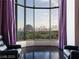 Cozy living room with large windows, comfortable seating, and skyline views at 360 E Desert Inn Rd # 807, Las Vegas, NV 89109