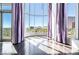 Bright living room featuring hardwood floors, large windows, and city views at 360 E Desert Inn Rd # 807, Las Vegas, NV 89109
