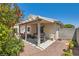 Backyard featuring a covered patio, grill, and low-maintenance gravel landscaping at 3629 Ferrell St, North Las Vegas, NV 89032
