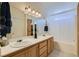 Well-lit bathroom with double sinks, modern lighting, and a shower-tub combination at 3629 Ferrell St, North Las Vegas, NV 89032