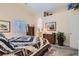 Bright bedroom with a large bed, carpet floors, window, and walk-in closet access at 3629 Ferrell St, North Las Vegas, NV 89032