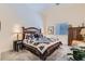Comfortable bedroom featuring a decorative quilt, side tables, and a view of the window at 3629 Ferrell St, North Las Vegas, NV 89032