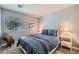 Cozy bedroom with a bed, window, and side tables with lamps at 3629 Ferrell St, North Las Vegas, NV 89032