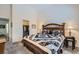 Comfortable bedroom featuring a decorative quilt and a view of the walk-in closet at 3629 Ferrell St, North Las Vegas, NV 89032