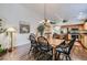 Dining room seamlessly connected to the kitchen, with hardwood floors and a charming light fixture at 3629 Ferrell St, North Las Vegas, NV 89032