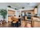 Charming kitchen featuring stainless steel appliances, wooden cabinets, and center island with stools at 3629 Ferrell St, North Las Vegas, NV 89032