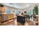 Open kitchen and dining area featuring stainless steel appliances, granite counters and hardwood floors at 3629 Ferrell St, North Las Vegas, NV 89032