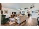 Open-concept living room showcasing hardwood floors, lots of seating, and natural light at 3629 Ferrell St, North Las Vegas, NV 89032