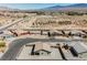 An aerial view of a desert community showcasing homes with well-kept yards, desert landscaping, and mountain views at 37 Late Harvest Ave, Pahrump, NV 89060