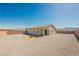 Desert landscape backyard with decorative fire pit and block wall offering potential for customization at 37 Late Harvest Ave, Pahrump, NV 89060
