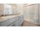 Ensuite bathroom with double granite vanity and glass enclosed shower at 37 Late Harvest Ave, Pahrump, NV 89060