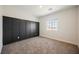 Bedroom featuring carpet floors, and a board and batten accent wall at 37 Late Harvest Ave, Pahrump, NV 89060