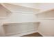 Walk-in closet with wood shelving and carpet floors at 37 Late Harvest Ave, Pahrump, NV 89060