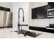 Close-up of a modern kitchen sink featuring a stainless-steel faucet and white countertop at 37 Late Harvest Ave, Pahrump, NV 89060