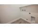 A functional laundry room with tile flooring and essential hookups for modern appliances at 37 Late Harvest Ave, Pahrump, NV 89060