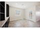 Office with black built-in shelves, neutral tile floors and lots of natural light at 37 Late Harvest Ave, Pahrump, NV 89060