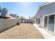 Low maintenance backyard with gravel, block wall and patio; ready for personalization at 4036 E Ogden Ave, Las Vegas, NV 89110