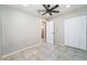 Cozy bedroom with tile flooring, closet space, and ceiling fan for added comfort at 4036 E Ogden Ave, Las Vegas, NV 89110