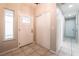Inviting entryway with tile flooring, a large storage closet, and a bright front door at 4036 E Ogden Ave, Las Vegas, NV 89110
