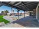 Inviting back patio with covered area overlooking a sparkling pool, perfect for outdoor entertaining at 4061 W Eldorado Ln, Las Vegas, NV 89139