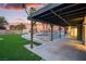 Spacious backyard featuring a covered patio, pool, and putting green at 4061 W Eldorado Ln, Las Vegas, NV 89139