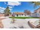 Charming backyard featuring a well-maintained lawn and decorative rock landscaping at 4061 W Eldorado Ln, Las Vegas, NV 89139
