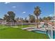 Lush backyard with pool, palm trees and lounge area at 4061 W Eldorado Ln, Las Vegas, NV 89139