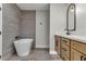 Bathroom featuring standalone tub, stone floors, quartz countertop and modern cabinets at 4061 W Eldorado Ln, Las Vegas, NV 89139