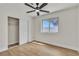 Cozy bedroom with light hardwood floors, closet, and window at 4061 W Eldorado Ln, Las Vegas, NV 89139