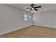 A well lit bedroom with a ceiling fan and a large window at 4061 W Eldorado Ln, Las Vegas, NV 89139