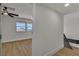 Bright bedroom with ceiling fan, hardwood floors, and natural light from windows at 4061 W Eldorado Ln, Las Vegas, NV 89139