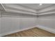 Walk-in closet with hardwood floors and white shelving at 4061 W Eldorado Ln, Las Vegas, NV 89139