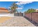 Long brick driveway leading to a secure gate offering a private entrance to the home at 4061 W Eldorado Ln, Las Vegas, NV 89139