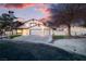 Charming two-story home features a well-maintained front yard and a spacious three-car garage at 4061 W Eldorado Ln, Las Vegas, NV 89139