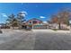 Charming home with a three-car garage, manicured landscaping, and circular window at 4061 W Eldorado Ln, Las Vegas, NV 89139