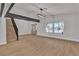 Bright living room featuring hardwood floors, large windows, and staircase at 4061 W Eldorado Ln, Las Vegas, NV 89139