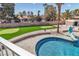 Refreshing pool and landscaped backyard with putting green, ideal for leisure and recreation at 4061 W Eldorado Ln, Las Vegas, NV 89139
