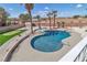 Inviting swimming pool surrounded by lush landscaping and a putting green, great for relaxation and fun at 4061 W Eldorado Ln, Las Vegas, NV 89139