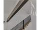 Stylish floating staircase featuring contemporary lighting and a sleek design at 4061 W Eldorado Ln, Las Vegas, NV 89139